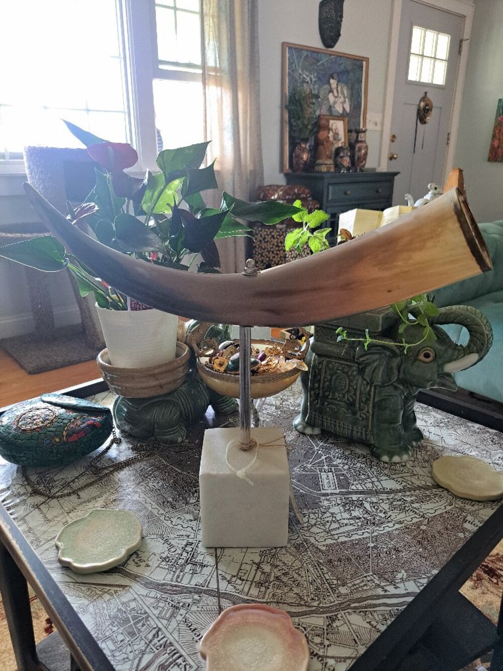 decorative sculpture featuring a polished cow bull steer horn mounted on a recta